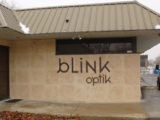 Blink-Optic Building sign: cut out aluminum letters painted
